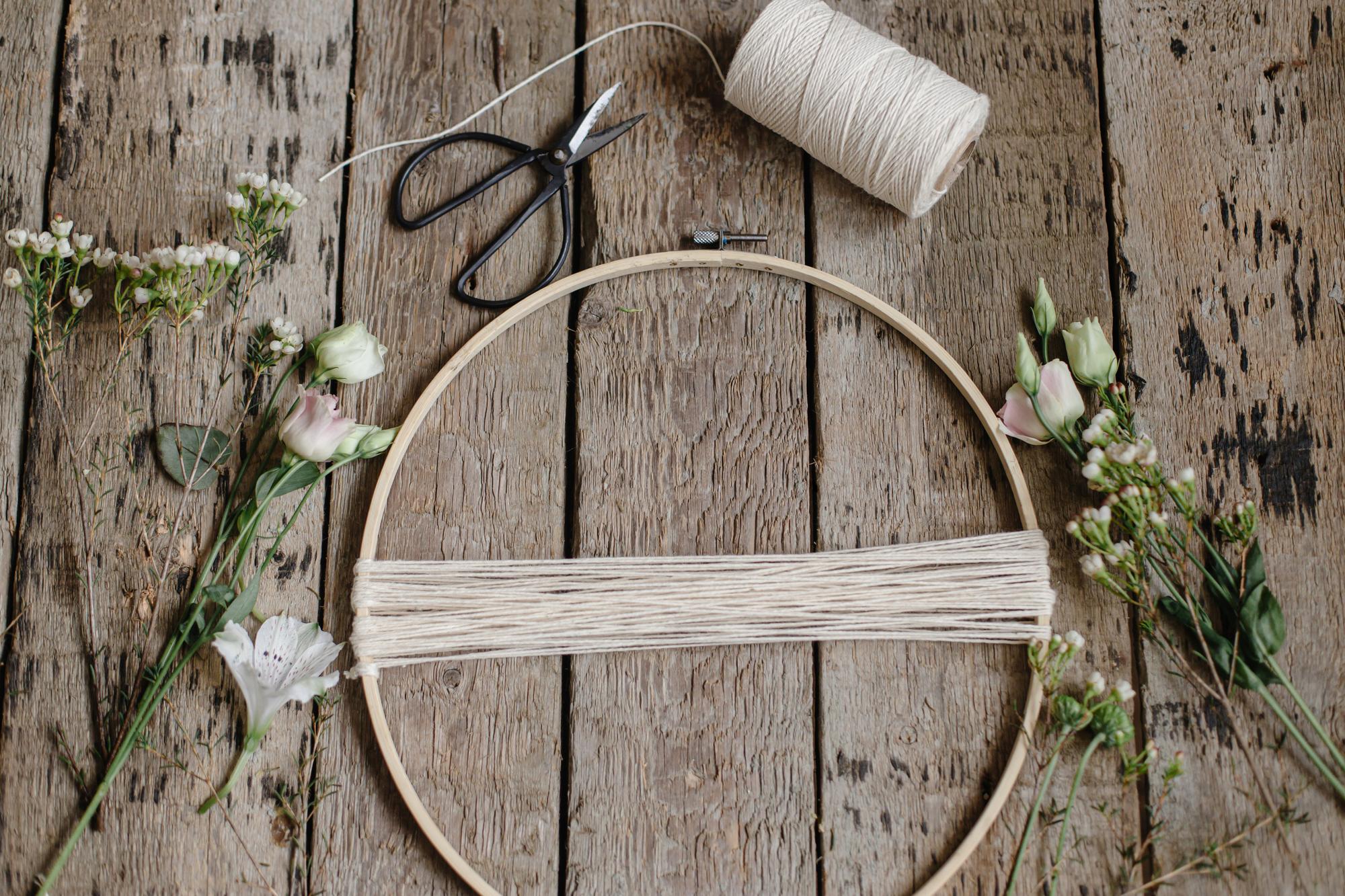 atelier table with threads and hoop in natural light