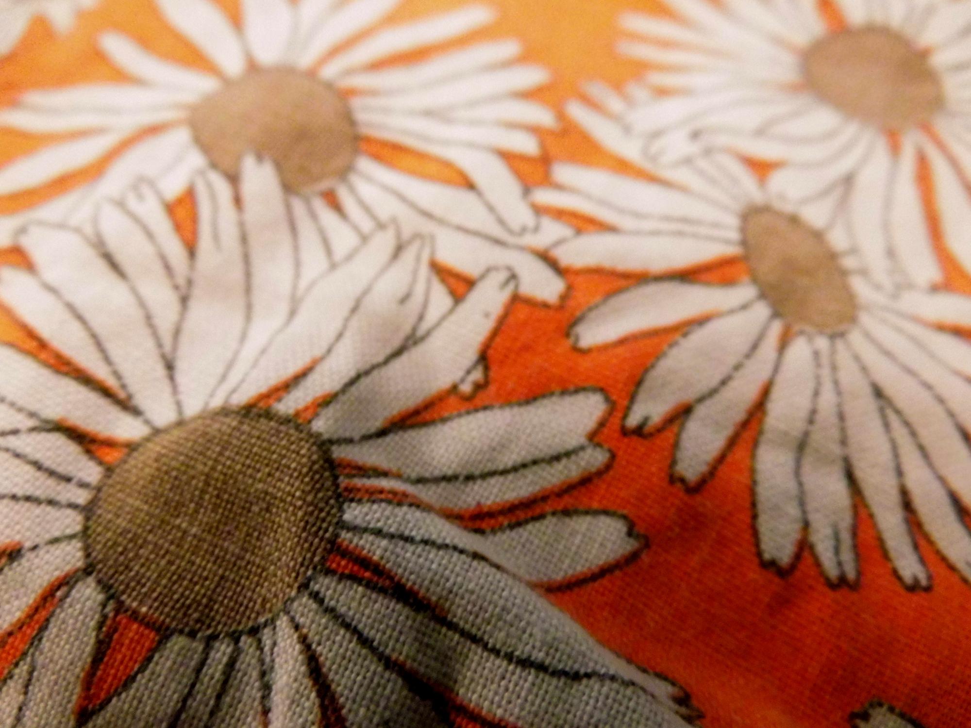 close-up embroidered patch with floral motif